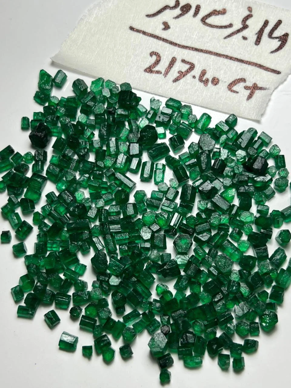 Javaaz rough emerald parcel with its handwritten weight note